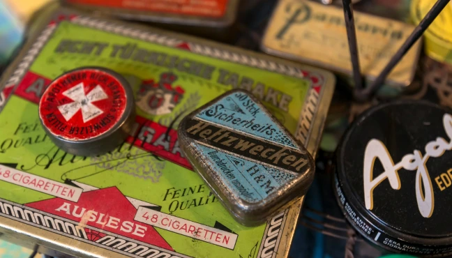 Close-up of vintage tins and colorful retro product labels.